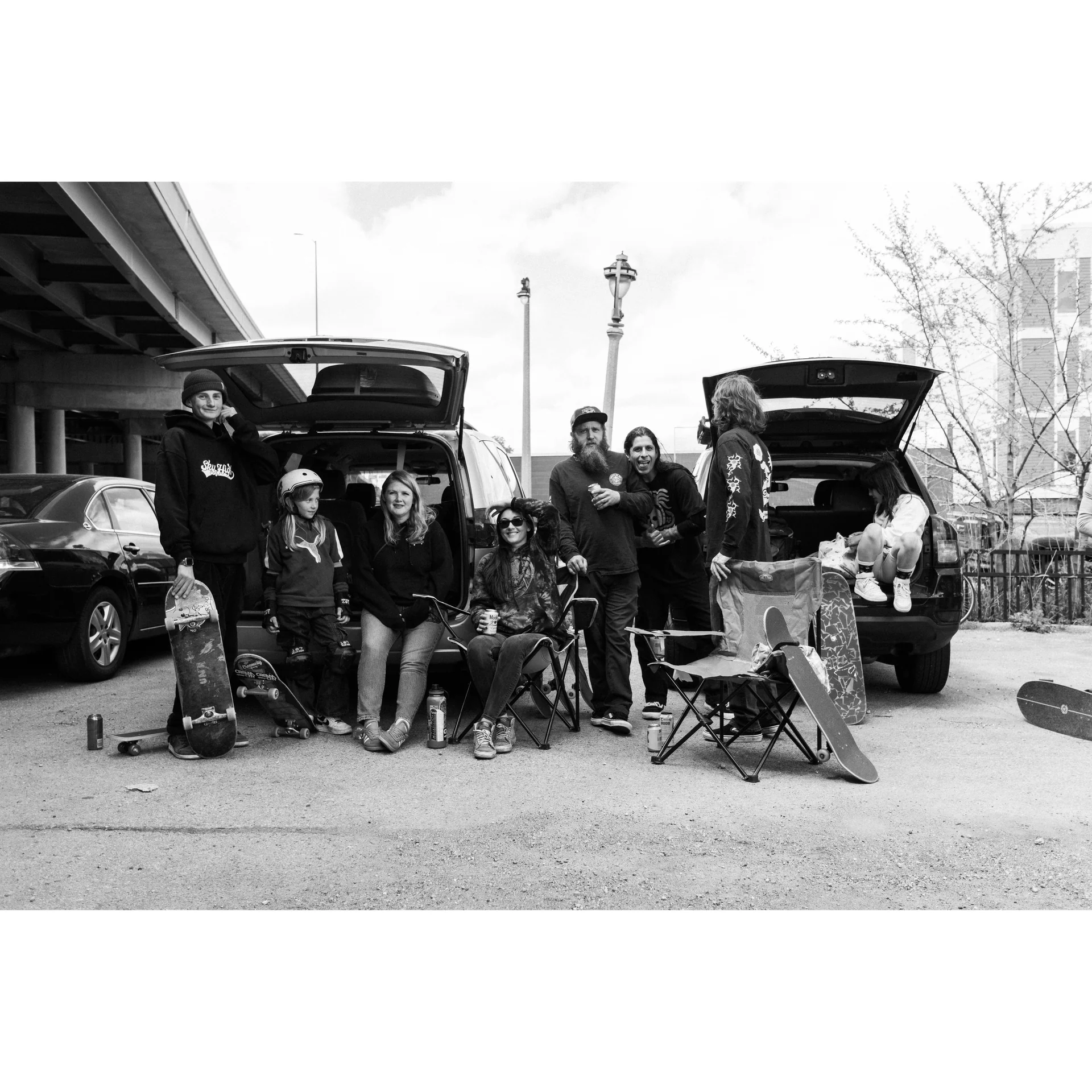A black and white photo showing a big family of skaters enjoying their day during a National DIY skate jam. Photo shot by Isaac Harris.